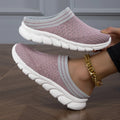 Women's black Flyknit semi-slipper casual shoe with striped pattern and hollow-out design on a white background.