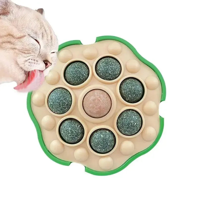 Four green lotus-shaped catnip balls mounted on wall for interactive feline play