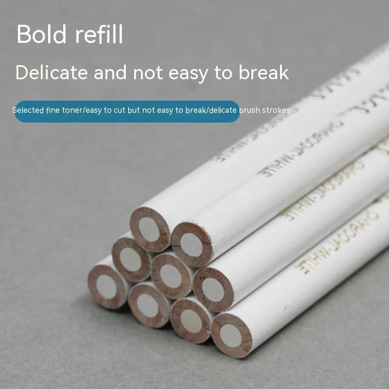 Three white charcoal sketching pencils with wooden barrels in a set.