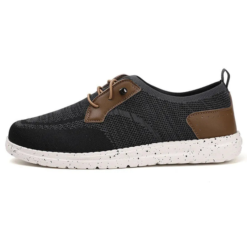 Men's black laceless canvas slip-on casual shoes with a round toe and rubber sole.