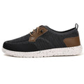 Men's black laceless canvas slip-on casual shoes with a round toe and rubber sole.