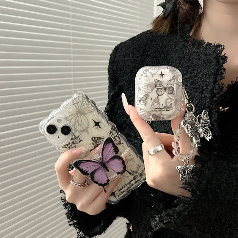 Butterfly embossed TPU protective cover for AirPods case with beaded pendant on blue background
