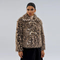 Women's leopard print coat with a buckle lapel fastening on a hanger.
