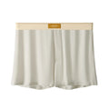 Men's solid colour loose fit ice silk underwear in a multi-pack on a grey background.