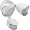 White LED security flood light with motion sensor mounted on an exterior wall