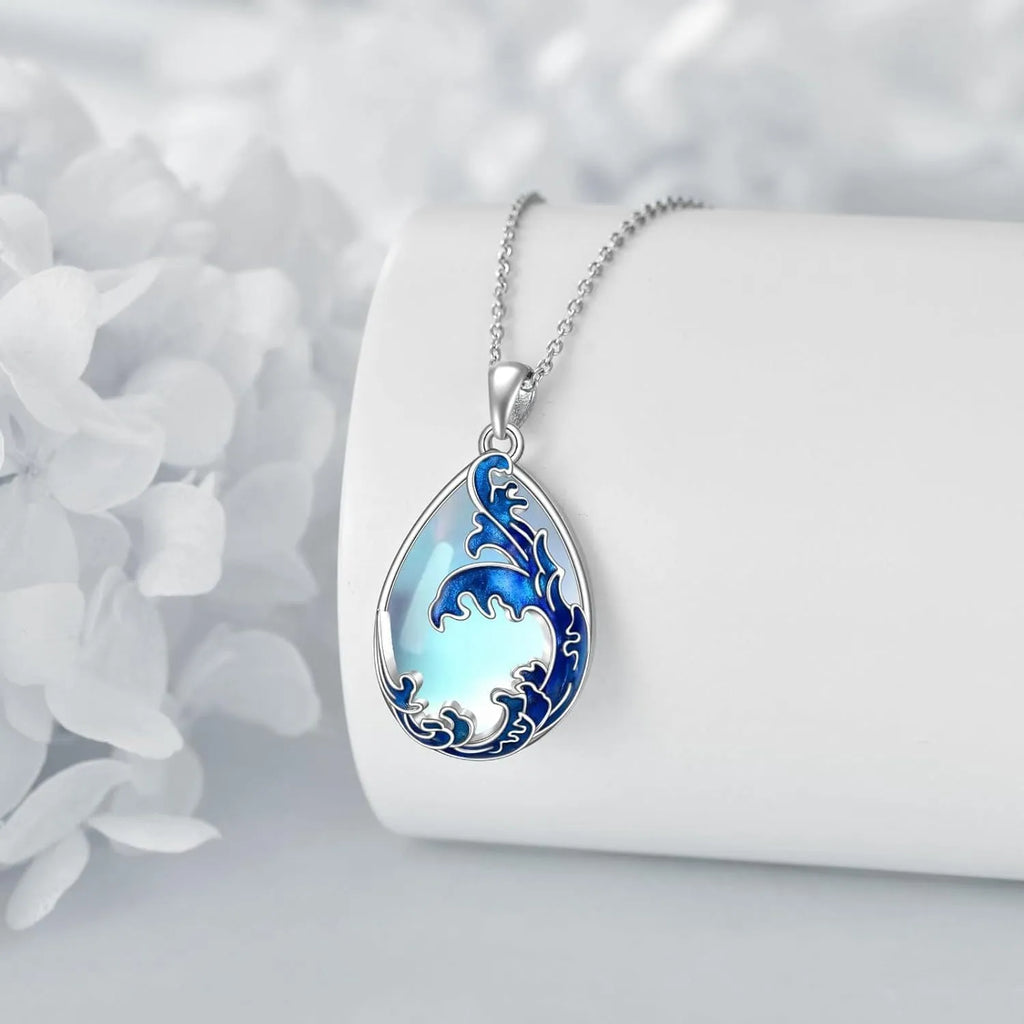 Blue alloy love heart pendant on a women's necklace chain.