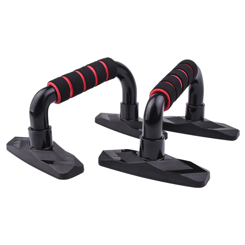 Pair of I-shaped black push up bars with grey PP sponge foam grips on a floor.