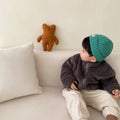 Blue children's sherpa fleece winter coat with full zip, high collar, and front pockets on a hanger.