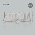 Contoured mulberry silk sleep mask in champagne gold colour, shown resting on a pillow.
