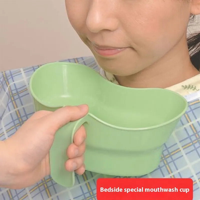 Green plastic gargle cup for bedridden elderly oral care and nursing.