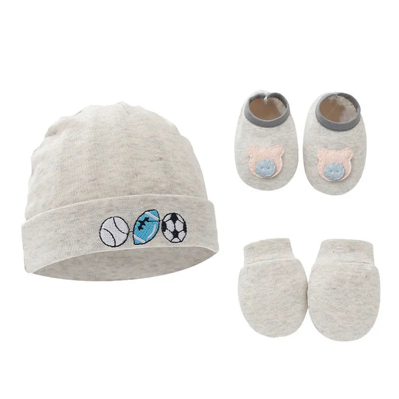 Set of white, light blue, and grey cotton baby pullover caps, gloves, and foot covers for infants.