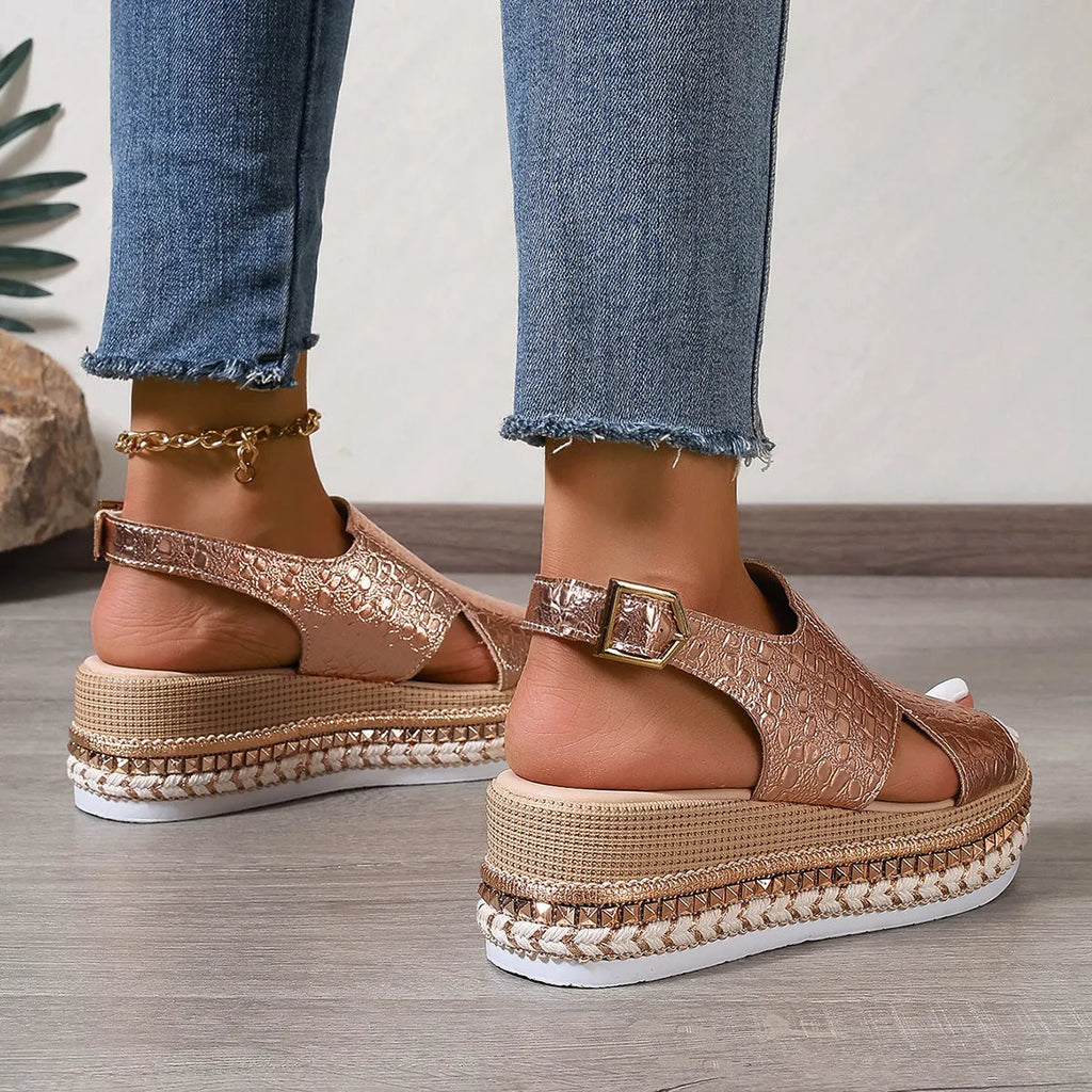 Gold women's Roman sandals with round toe and adjustable ankle buckle.