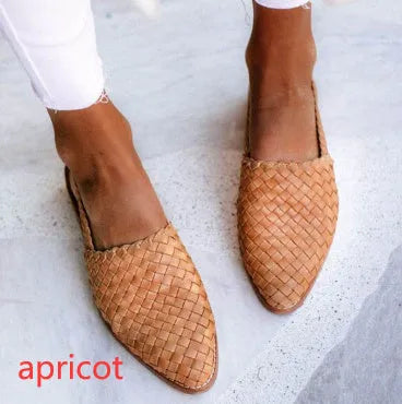 A pair of pointed-toe baotou flat sandals with an adjustable buckle strap, shown in a dark brown colour.
