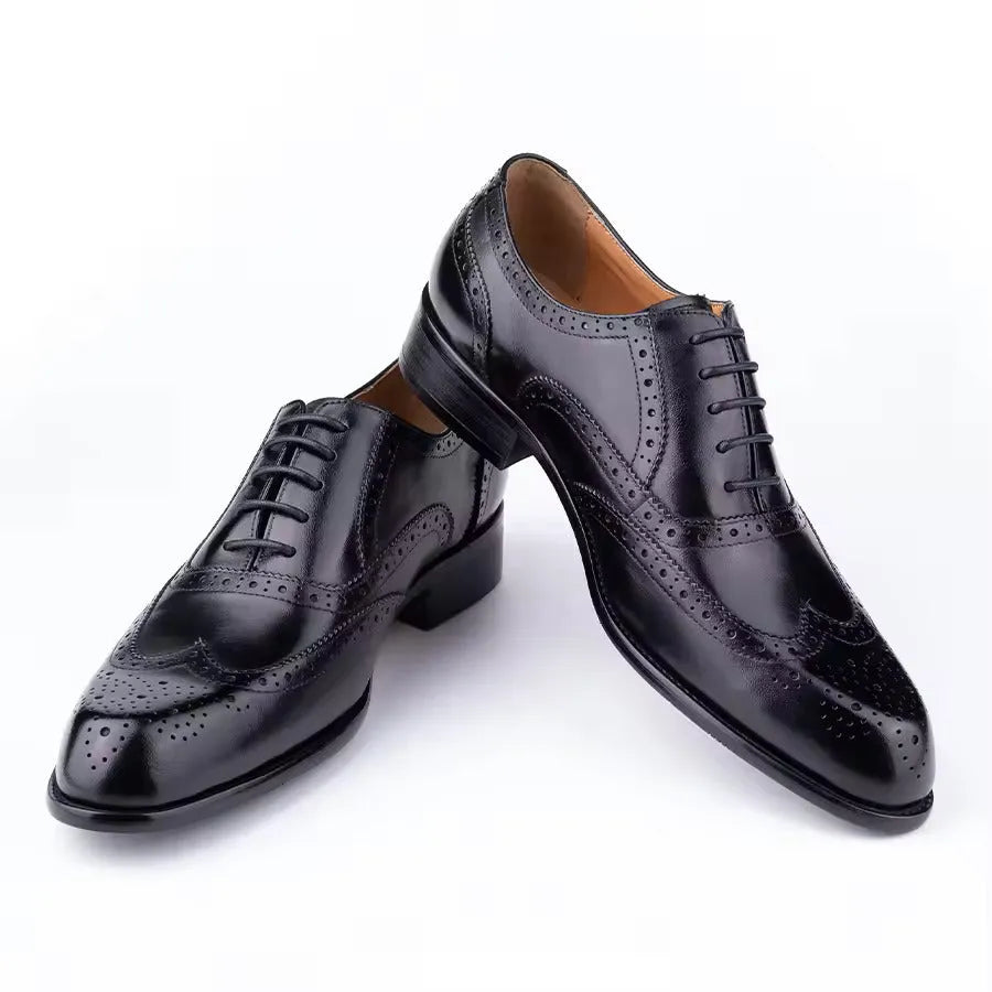 Men's purple leather Oxford dress shoes with hand-carved detail and pointed toe on a rubber sole.