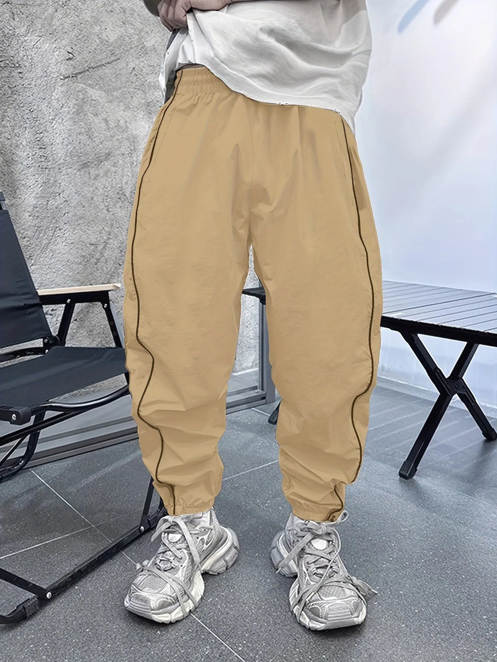 Men's loose fit bamboo fibre sports trousers in khaki with cropped length and elasticated waist.