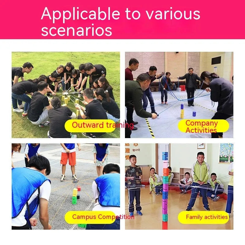 Outdoor team building game set showing coloured ABS plastic tower blocks, pull ropes, and a central hook frame on grass.