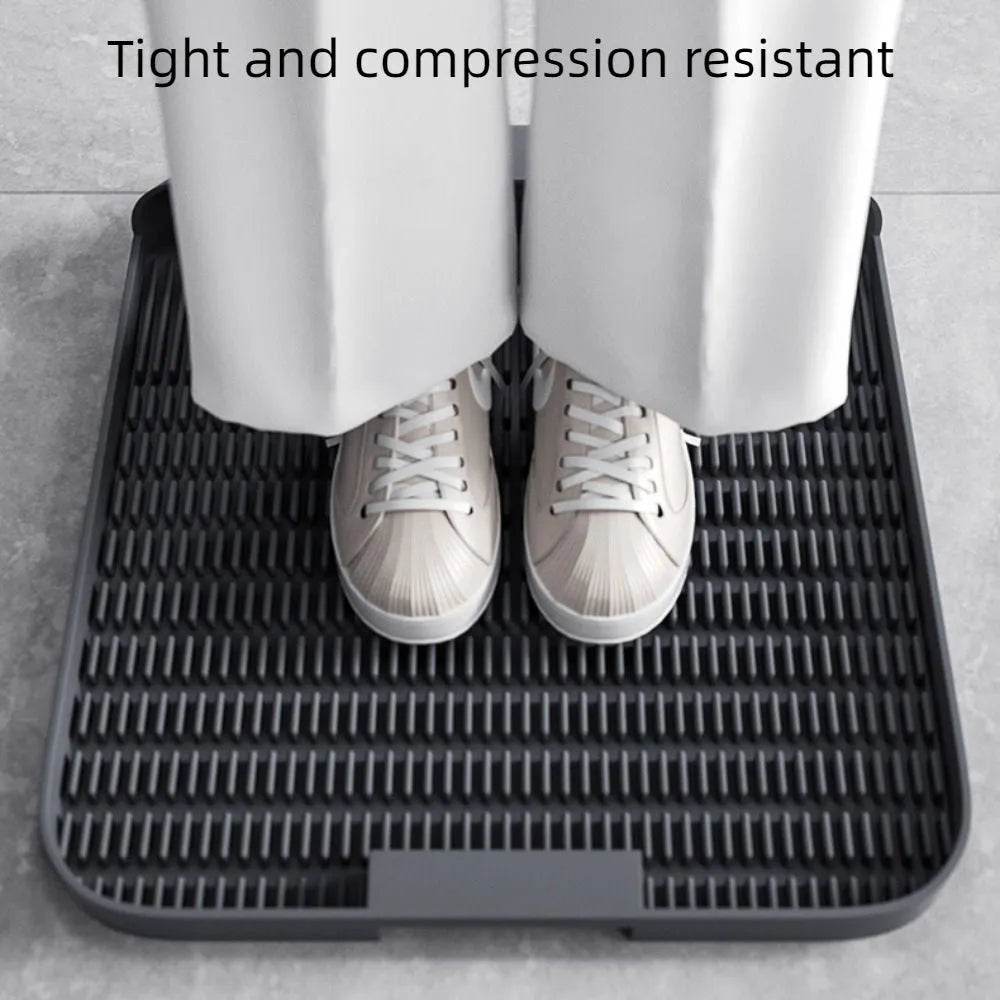 Large square black cat litter pedal mat with slanted design and textured grooves