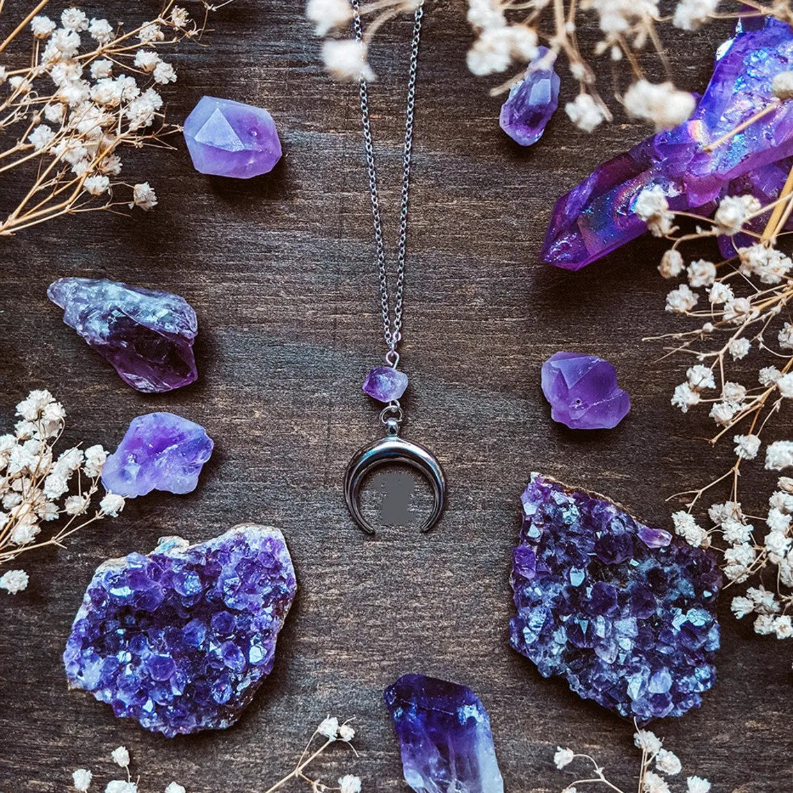 Silver moon-shaped pendant necklace with purple natural crystal centrepiece on alloy chain