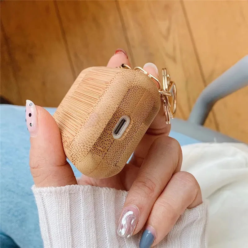 Bamboo AirPods cover with carbonised wood grain finish for generation 1 and 2 models
