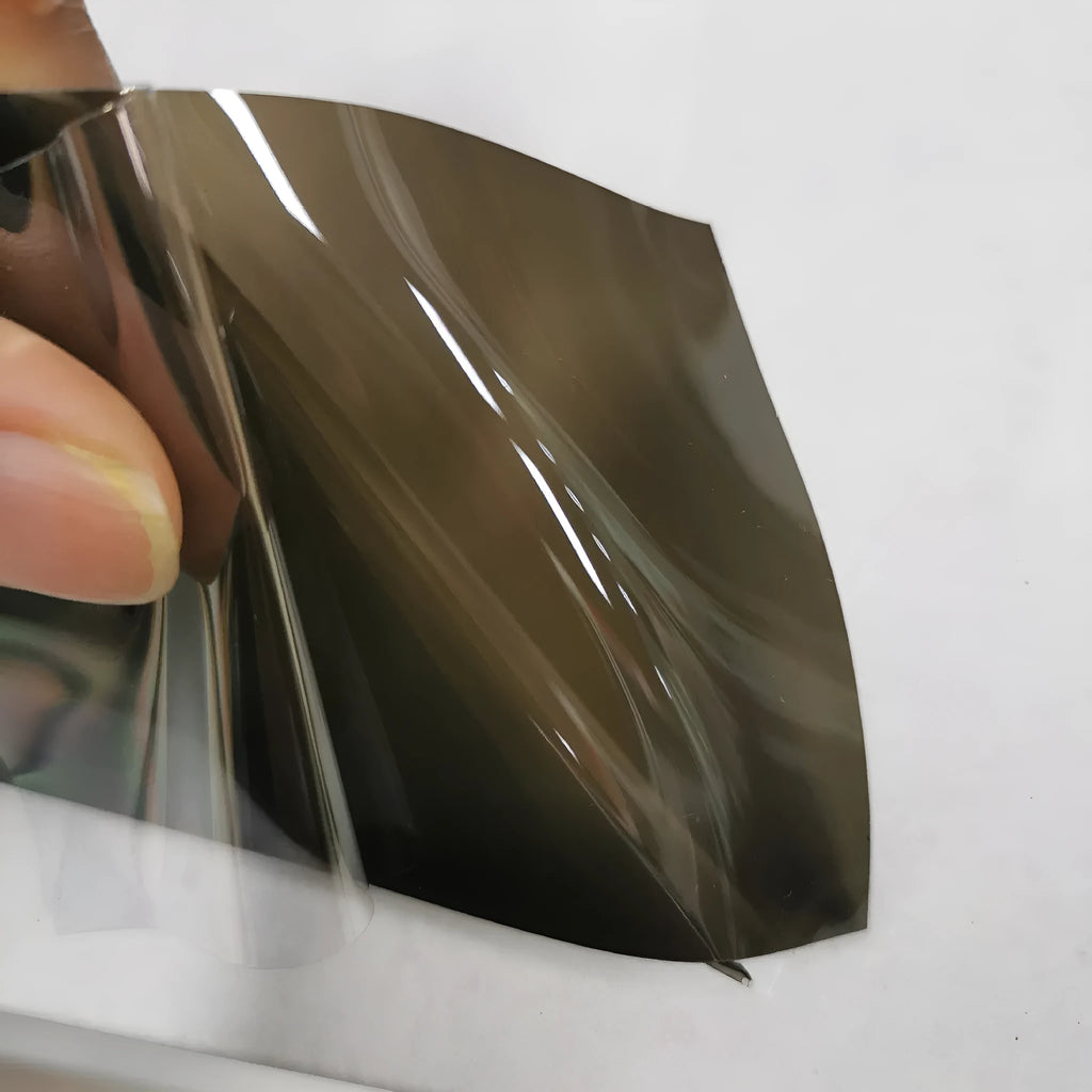 30cm wide plastic protective film roll for car LED lampshades in various colours including TPU dark grey and PVC black.