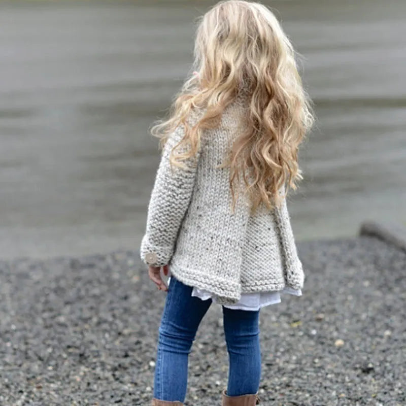Beige long sleeve girls cardigan sweater coat with single-breasted button closure.