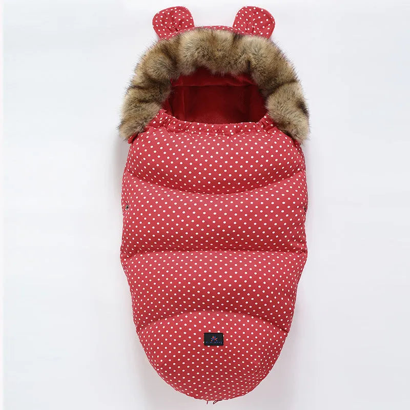 Baby warm cocoon style sleeping bag on a neutral background demonstrating solid colour design with zip closure