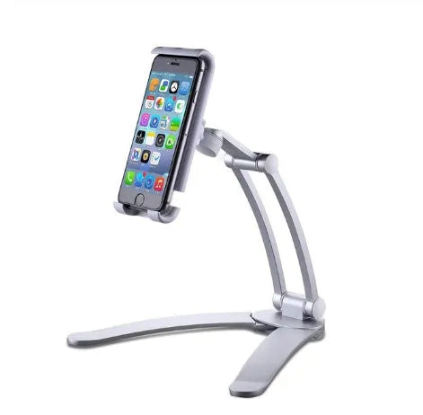 Silver aluminium desktop stand holding a tablet, showing 360-degree rotation and adjustable clamp mechanism.
