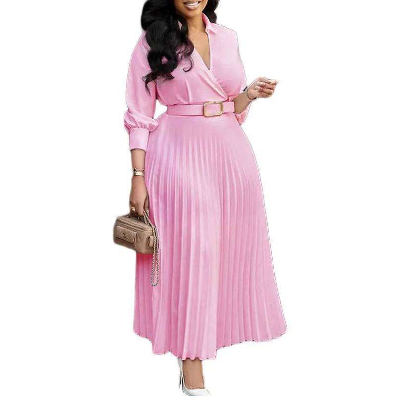 Mid-length solid colour pleated dress with 3/4 sleeves and an attached belt.
