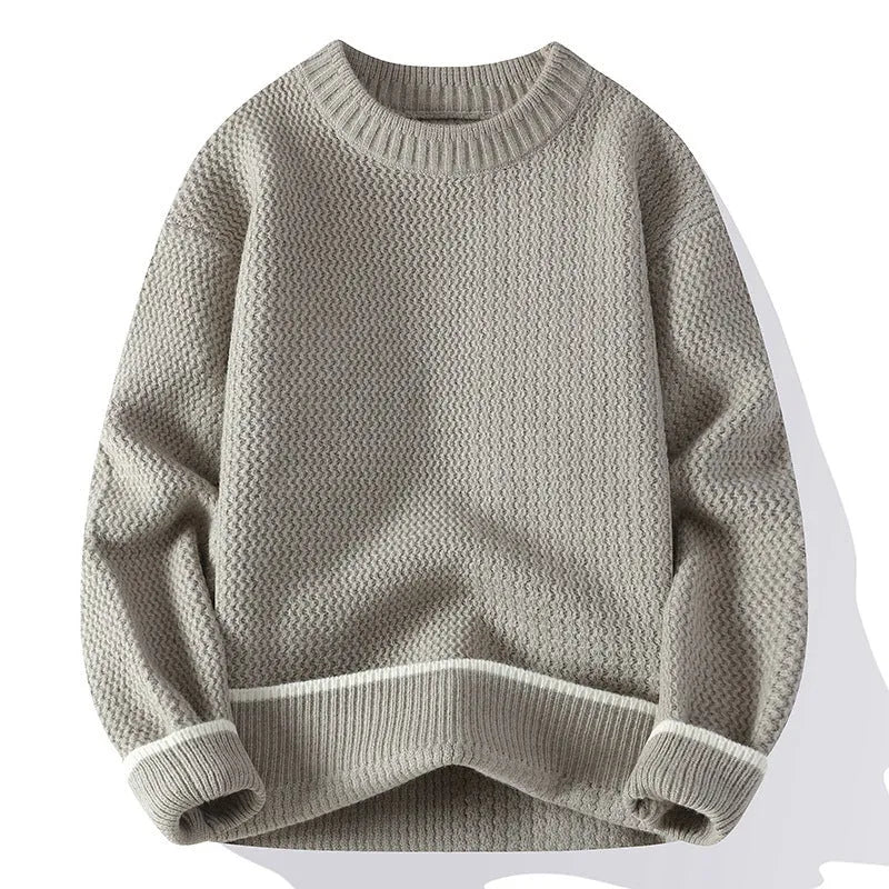 A grey men's loose round-neck pullover sweater with long sleeves on a hanger.