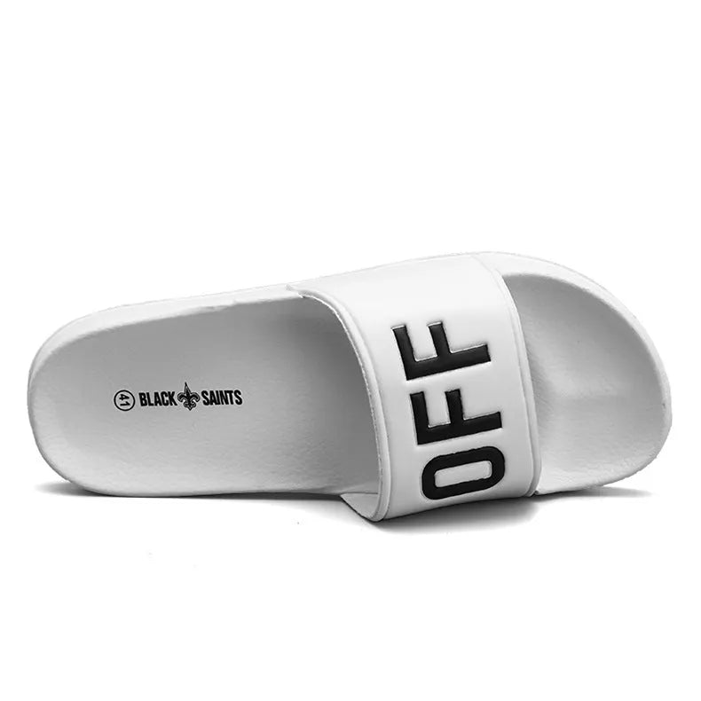 Black and white open-toe men's slippers with a rubber sole, shown on a size chart from 36 to 46.