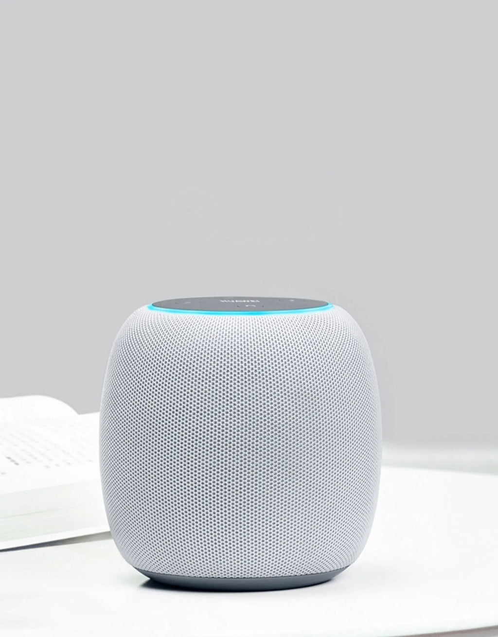 Compact AI smart speaker with voice control and Bluetooth connectivity.