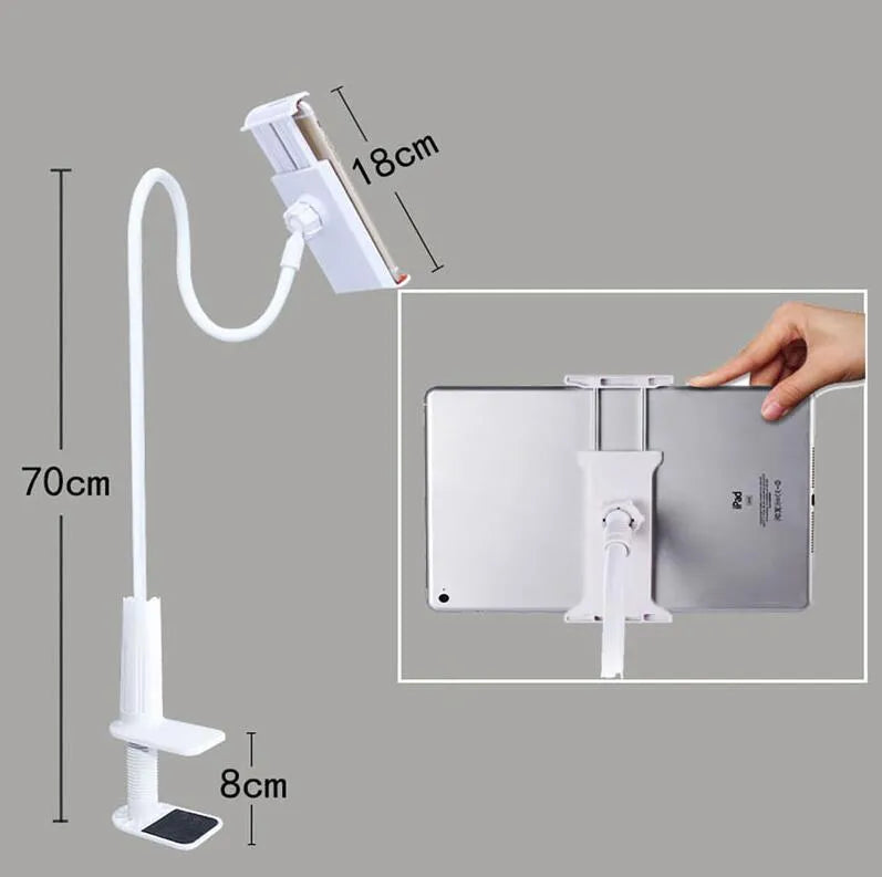 Black oversize flat panel phone holder with a long adjustable arm on a wooden table.
