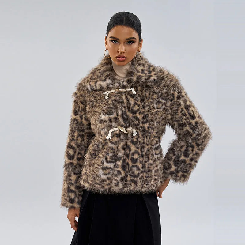 Women's leopard print coat with a buckle lapel fastening on a hanger.