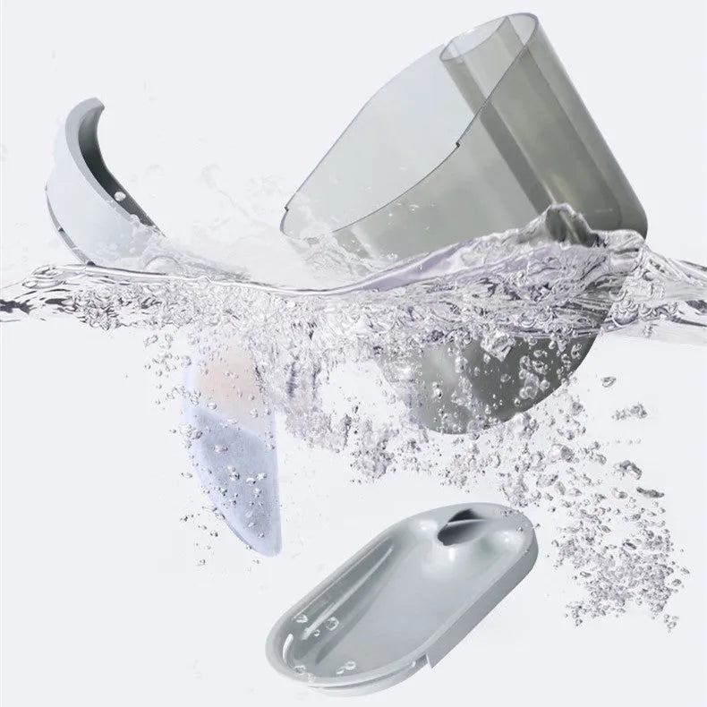 Automatic plastic drinking bowl for cats with infrared sensor, grey colour, on floor