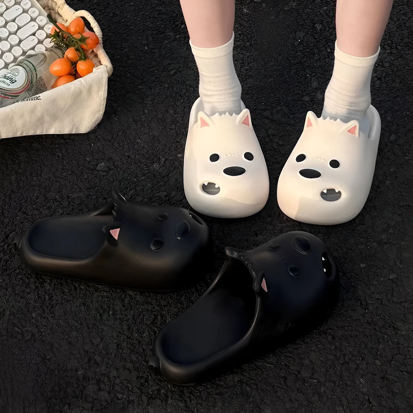 Women's black and white EVA puppy slippers with protective toe cap design