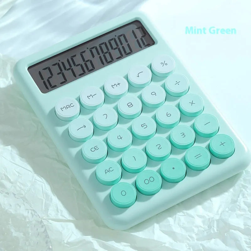 Desktop calculator with gradient colour finish in violet, cherry blossom pink, glacier blue, or mint green on a desk.