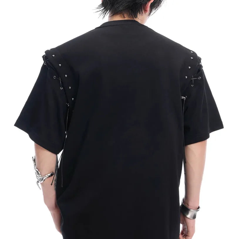 Black deconstructed short sleeve T-shirt with lace-up sides and cutout detailing on a mannequin.