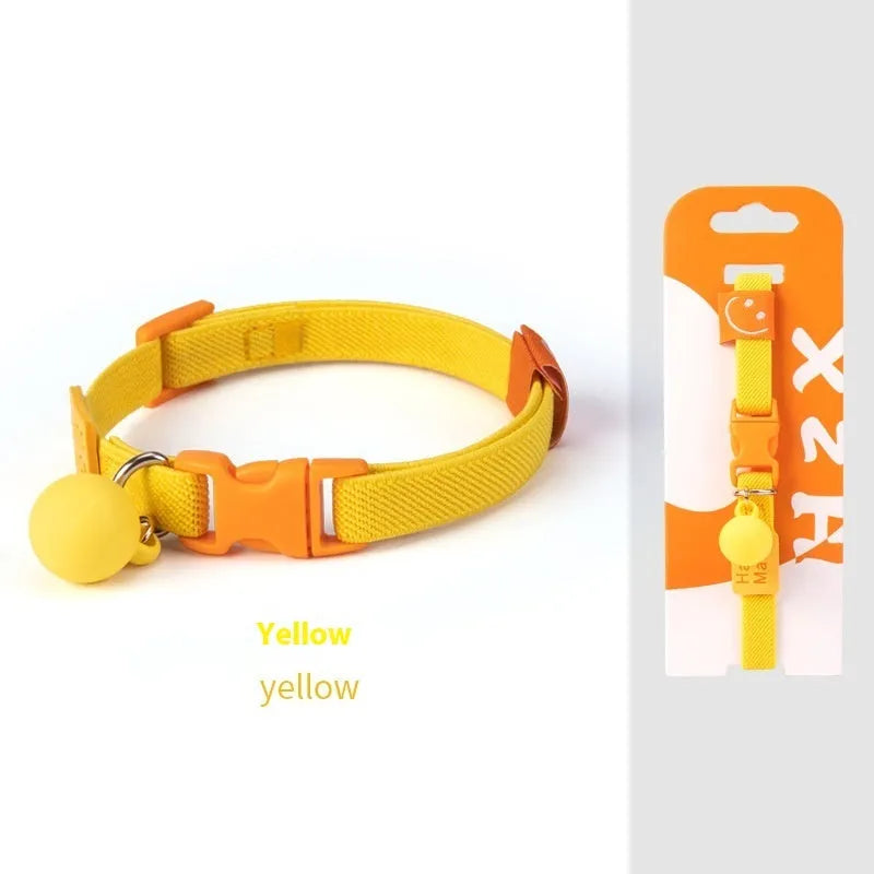 A small, elastic monochrome dog collar in sky blue with a plastic buckle, laid flat.