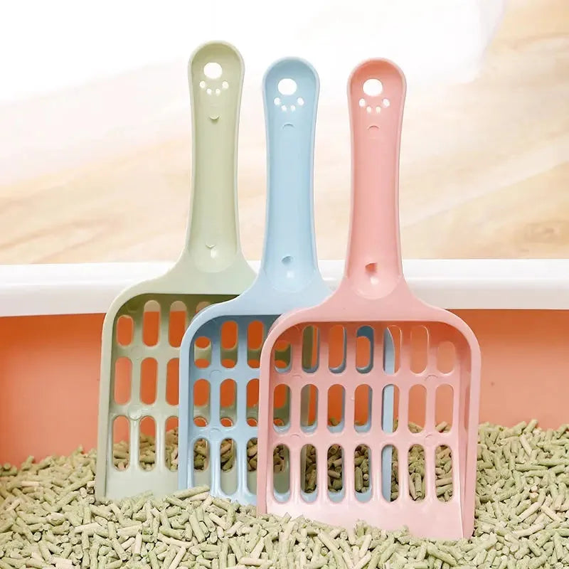 Plastic cat litter scoop in blue, green or pink colours measuring 20cm length