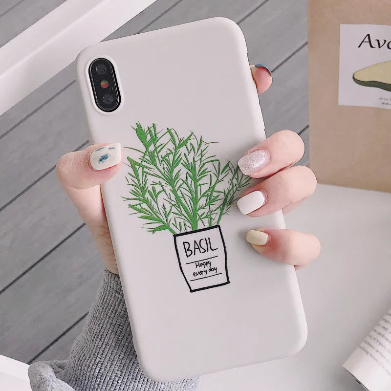 White silicone iPhone case with a detailed painted plant pattern on the back, showing its 360-degree protective edges.