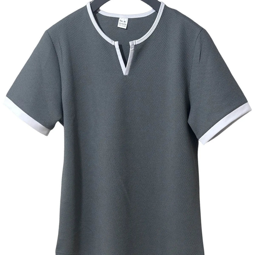 Colour-block V-neck short sleeve t-shirt in polyester waffle fabric on a neutral background.