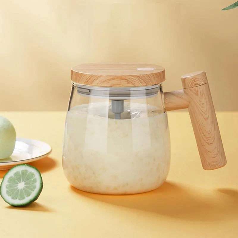 Clear borosilicate glass self-stirring coffee mug with button on base, 400ml capacity