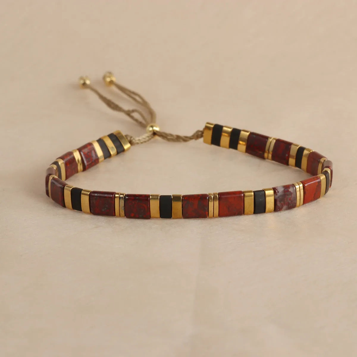 Geometric beaded bracelet with round glass and coloured glaze beads in five colour options.