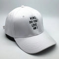 Letter embroidered cotton baseball cap in black with curved brim on white background