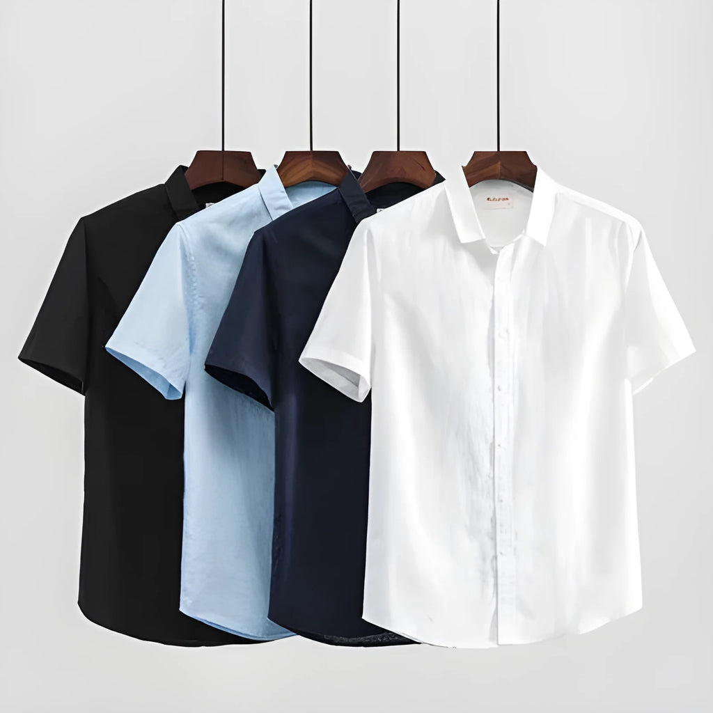 Man wearing a loose-fit light blue linen short sleeve shirt with a square collar, cardigan style.