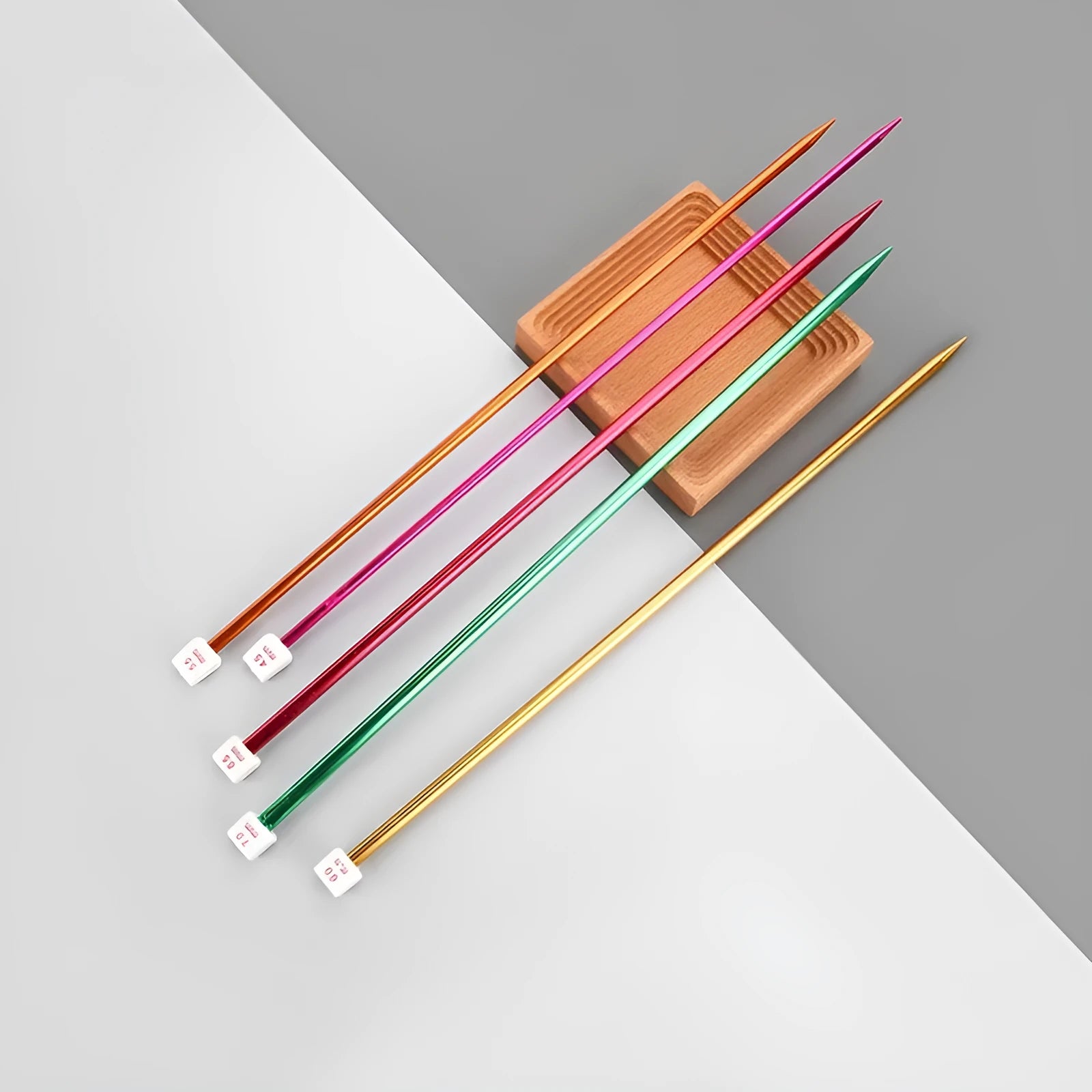 Complete crochet hook set showing 13 different sizes from 2.0mm to 10.0mm with ergonomic handle caps
