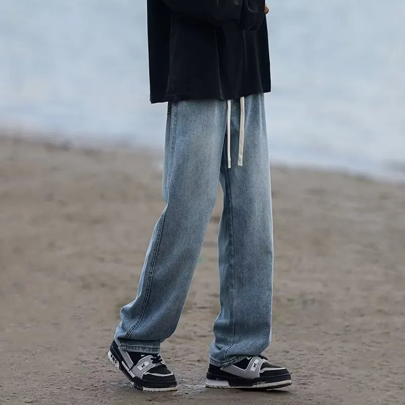Men's straight-leg cotton denim trousers in blue with drawstring waist and loose fit