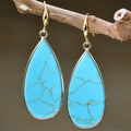 Vintage long drop earrings with tigereye stone in water drop silhouette
