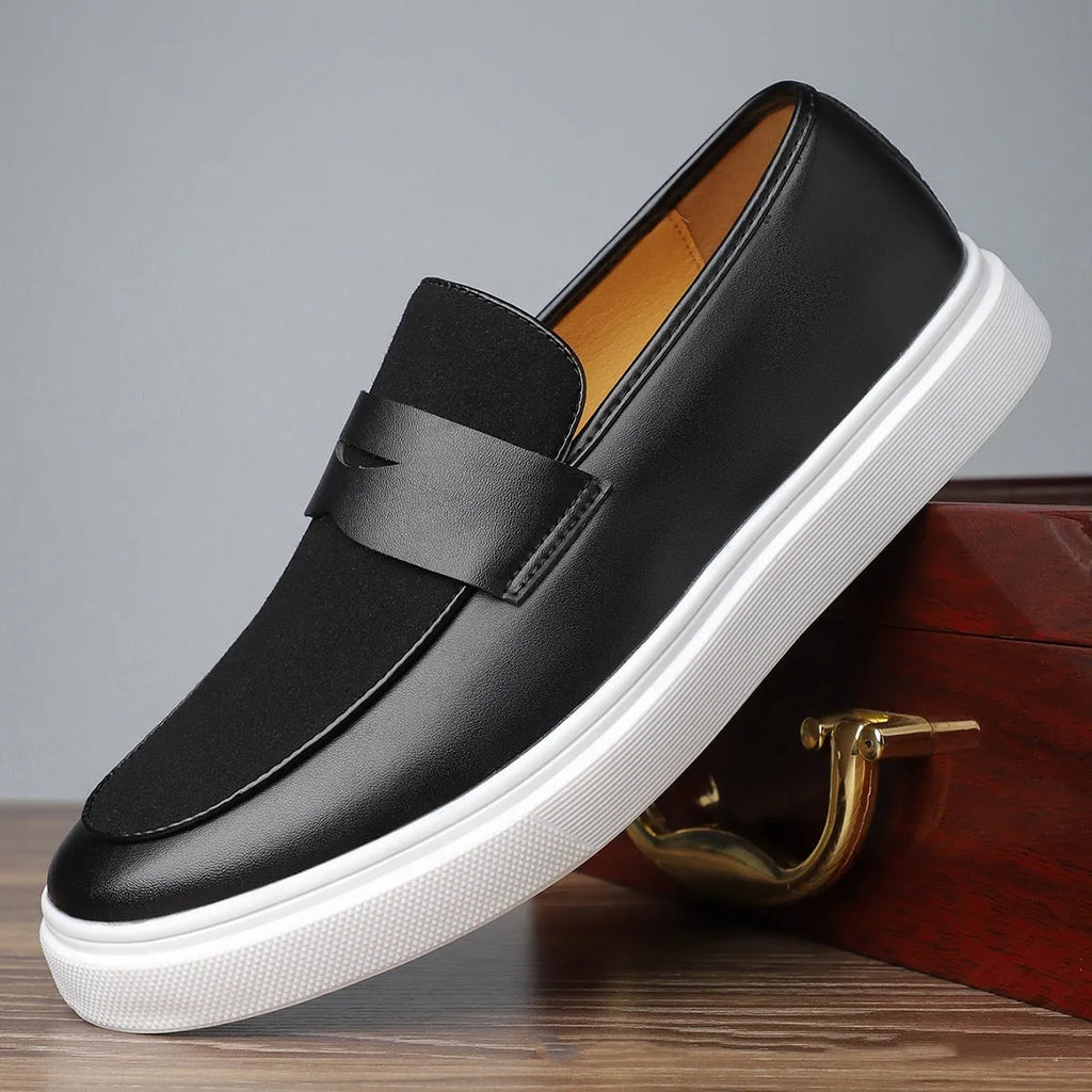 Men's black slip-on casual shoes with tassel detail and round toe