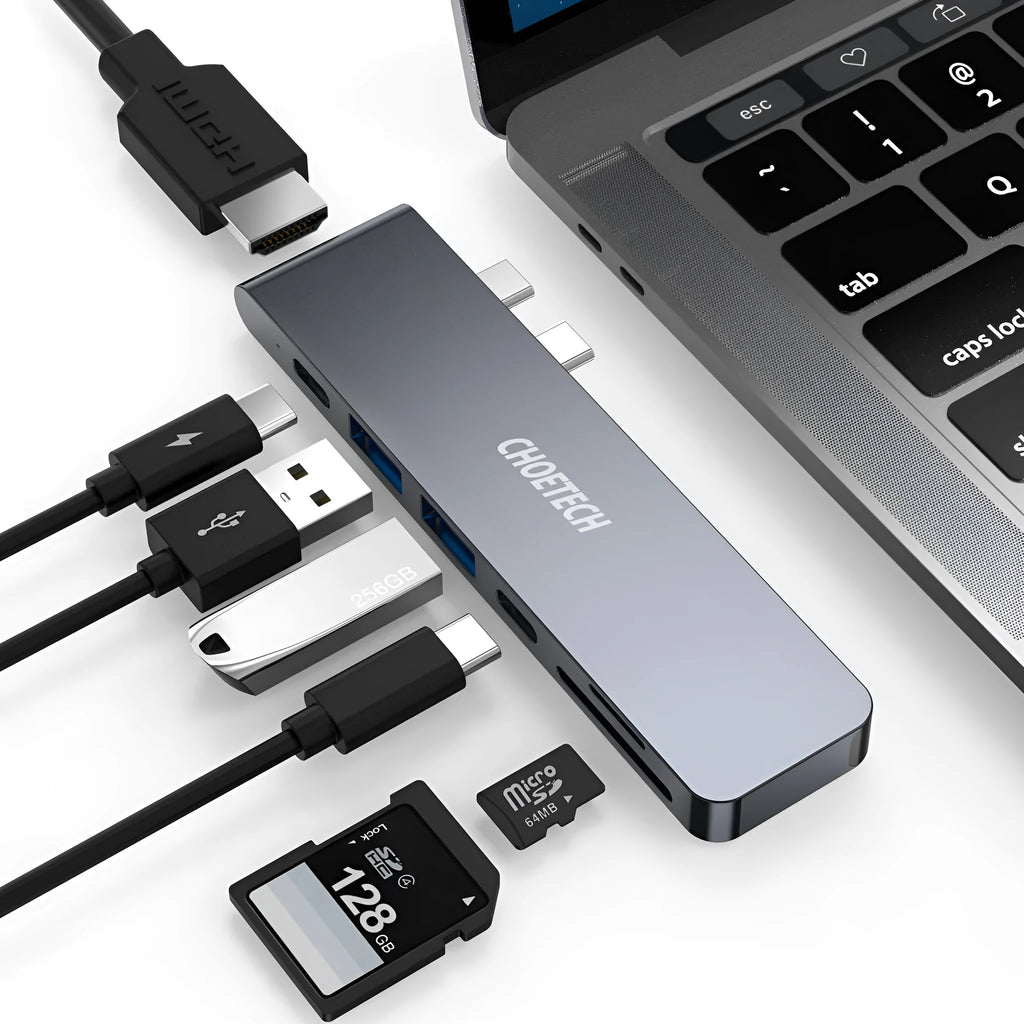 Silver aluminium USB C hub adapter with Thunderbolt 3, HDMI, SD card slots, and USB 3.0 ports